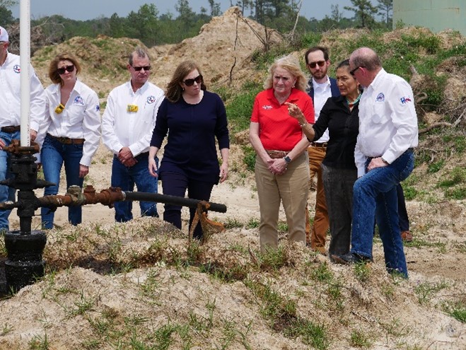 Clay Woodul, RRC Assistant Director of the Oil and Gas Division for Field Operations, shows Secretary Deb Haaland and members of Congress an orphaned well scheduled to be plugged in Houston